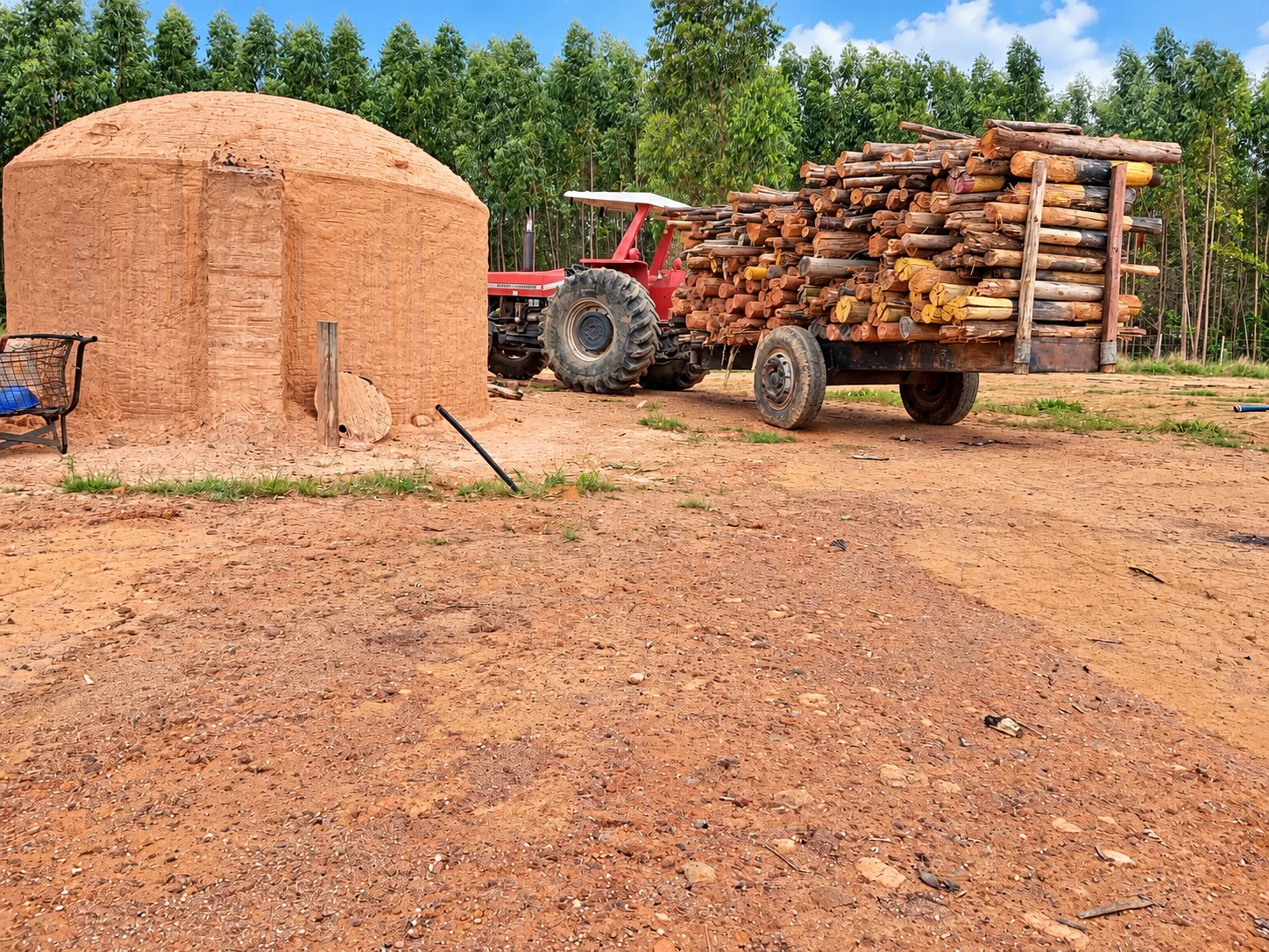 Charcoal kiln with timber handling equipment